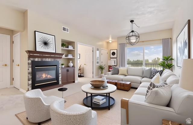 974 W Big River Ct Unit 2, South Salt Lake, UT 84119 - carpeted living room with visible vents, a glass covered fireplace, and built in shelves