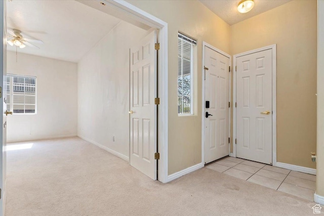 974 W Big River Ct Unit 2, South Salt Lake, UT 84119 - carpeted foyer entrance with baseboards, ceiling fan, and tile patterned flooring
