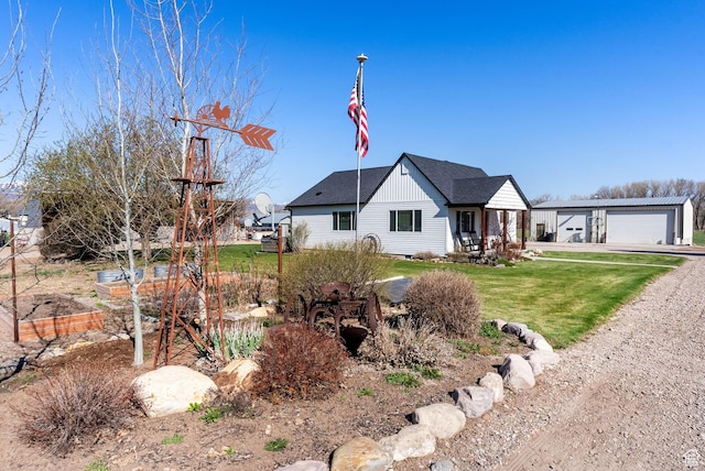 975 N 1400 W, Preston, ID 83263 - view of front of property featuring a detached garage, a shingled roof, and a front yard