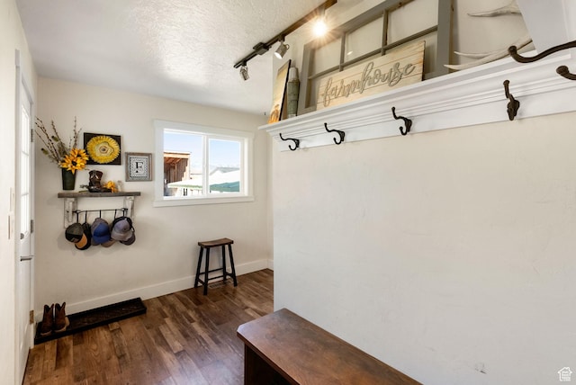 975 N 1400 W, Preston, ID 83263 - mudroom with rail lighting, baseboards, wood finished floors, and a textured ceiling