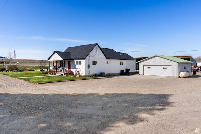 975 N 1400 W, Preston, ID 83263 - modern farmhouse style home featuring central air condition unit, an outdoor structure, and a garage