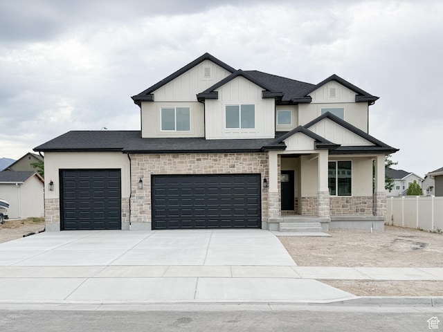 569 W 2030 N, Tooele, UT 84074 - craftsman house with stone siding, concrete driveway, a garage, a porch, and stucco siding