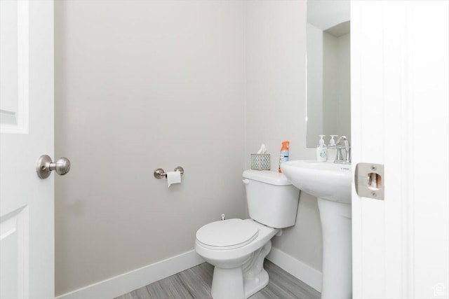 162 E 2480 N, North Logan, UT 84341 - half bathroom featuring baseboards, a sink, and toilet