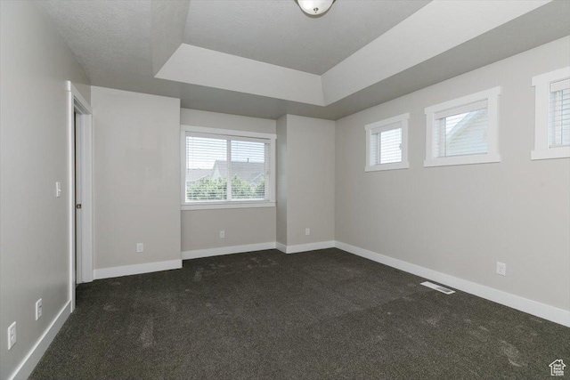 162 E 2480 N, North Logan, UT 84341 - unfurnished room featuring dark colored carpet, baseboards, and a tray ceiling