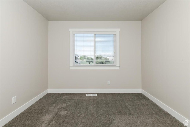 162 E 2480 N, North Logan, UT 84341 - empty room featuring dark carpet and baseboards