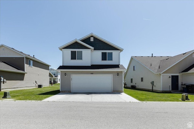 162 E 2480 N, North Logan, UT 84341 - craftsman house with concrete driveway, a garage, central AC, and a front yard