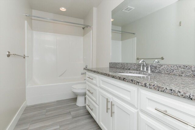 162 E 2480 N, North Logan, UT 84341 - bathroom featuring vanity, washtub / shower combination, toilet, recessed lighting, and baseboards