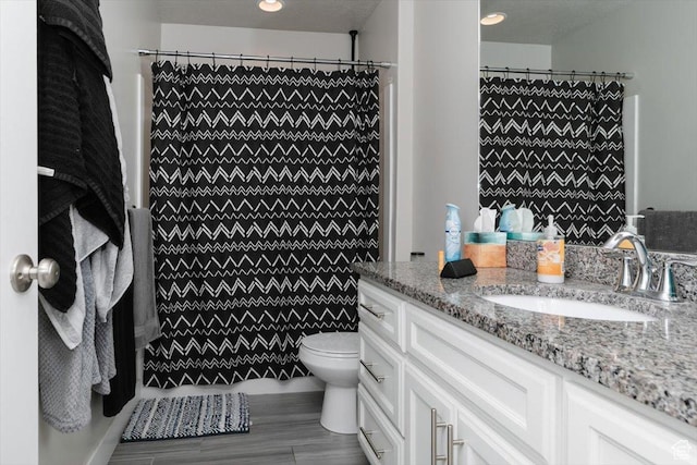 162 E 2480 N, North Logan, UT 84341 - full bathroom with wood finished floors, toilet, vanity, and tiled shower