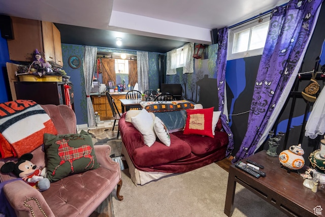 living area with carpet flooring and plenty of natural light