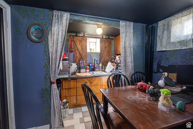 dining space featuring tile patterned floors and wallpapered walls