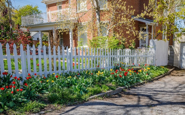 view of gate featuring a fenced front yard
