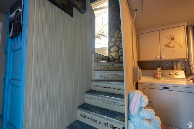 stairway featuring washer / dryer
