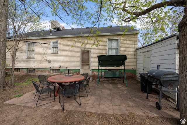 back of house with a patio area