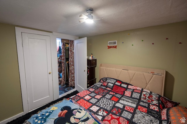 carpeted bedroom featuring baseboards and ceiling fan