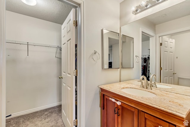 2093 N Morning Star Dr, Saratoga Springs, UT 84045 - bathroom with baseboards, vanity, and a walk in closet