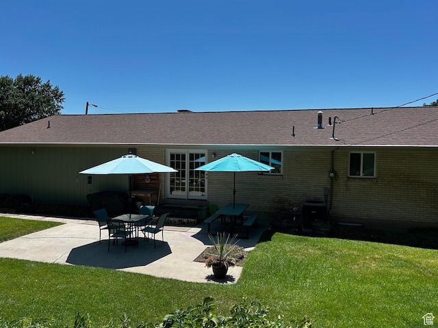 1026 W 3800 N, Pleasant View, UT 84414 - back of house with a patio area, a lawn, and a shingled roof