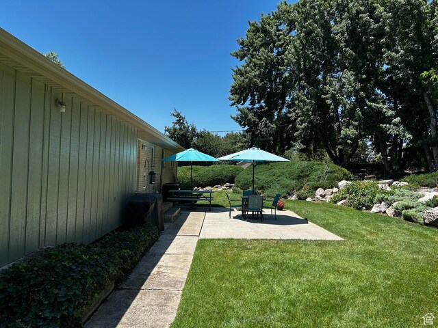 1026 W 3800 N, Pleasant View, UT 84414 - view of grassy yard with a patio