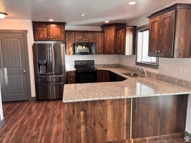 837 N 150 W, Santaquin, UT 84655 - kitchen featuring black appliances, a sink, a peninsula, a textured ceiling, and light stone countertops