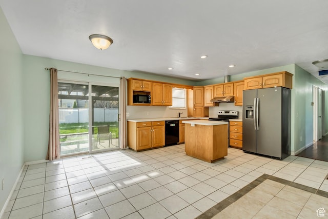3916 S Hawkeye Dr, West Valley City, UT 84120 - kitchen featuring light tile patterned flooring, light countertops, under cabinet range hood, a kitchen island, and black appliances