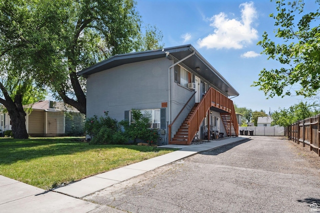 238 E Vidas Ave S, South Salt Lake, UT 84115 - view of front of house with stairway and asphalt driveway
