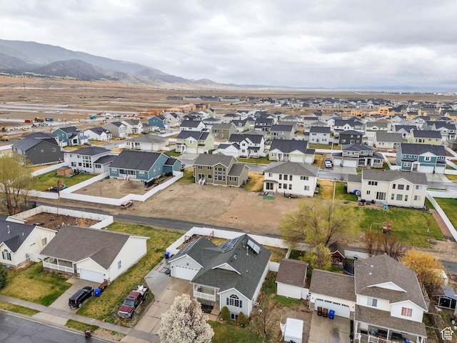 birds eye view of property featuring a mountain view and a residential view