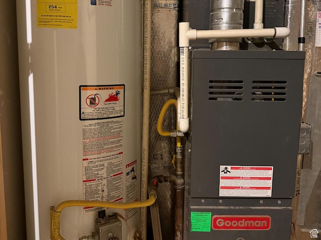 utility room with water heater and heating unit