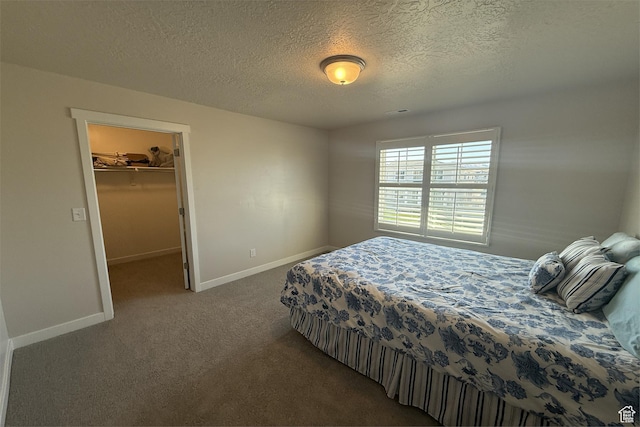 6129 W Coulee Ln, West Jordan, UT 84081 - bedroom featuring carpet, a walk in closet, a closet, baseboards, and a textured ceiling