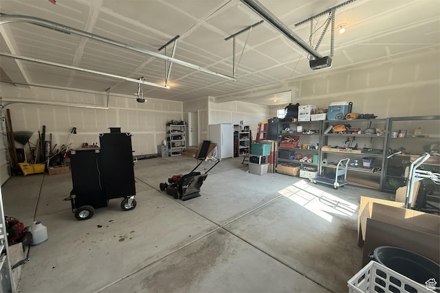 6129 W Coulee Ln, West Jordan, UT 84081 - garage featuring freestanding refrigerator and a garage door opener