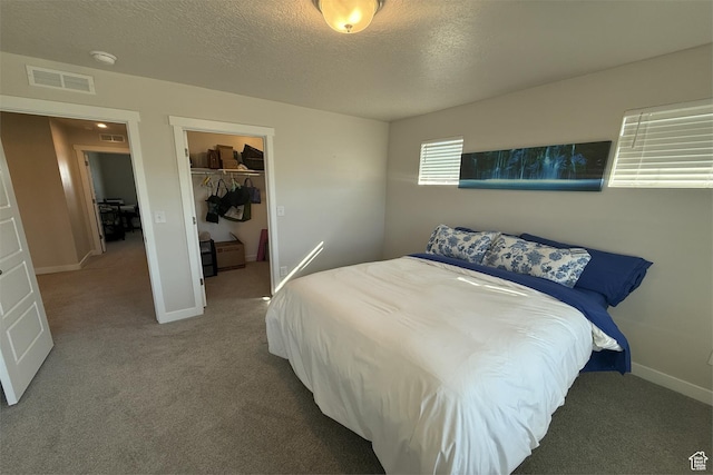 6129 W Coulee Ln, West Jordan, UT 84081 - carpeted bedroom featuring a textured ceiling, a closet, a spacious closet, baseboards, and visible vents