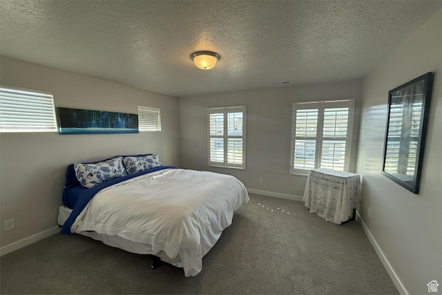 6129 W Coulee Ln, West Jordan, UT 84081 - carpeted bedroom featuring a textured ceiling, visible vents, and baseboards