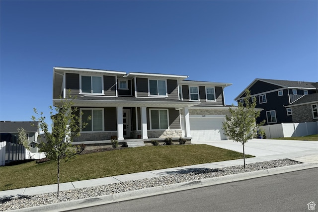 6129 W Coulee Ln, West Jordan, UT 84081 - traditional-style house with fence, concrete driveway, an attached garage, covered porch, and stone siding