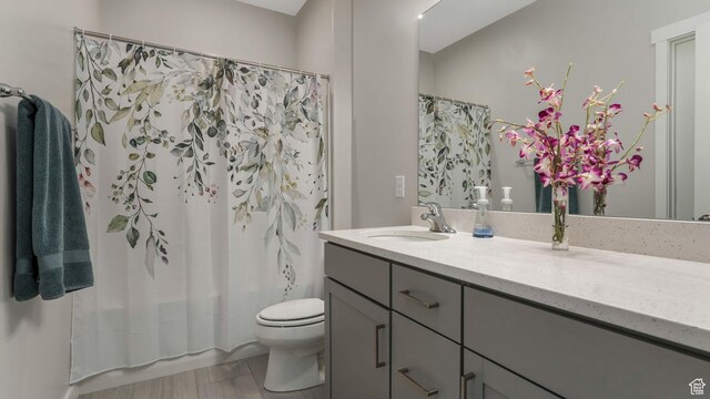 6129 W Coulee Ln, West Jordan, UT 84081 - bathroom featuring vanity, toilet, and shower / tub combo