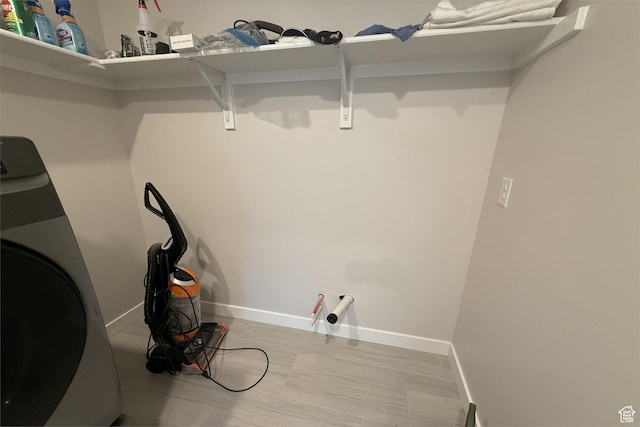 6129 W Coulee Ln, West Jordan, UT 84081 - clothes washing area with baseboards and washer / dryer