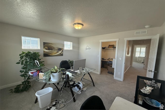6129 W Coulee Ln, West Jordan, UT 84081 - home office with a textured ceiling, visible vents, baseboards, and light carpet