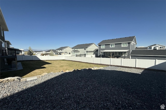6129 W Coulee Ln, West Jordan, UT 84081 - view of yard featuring a residential view and a fenced backyard