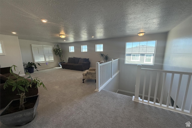 6129 W Coulee Ln, West Jordan, UT 84081 - carpeted living room with recessed lighting, a textured ceiling, and baseboards