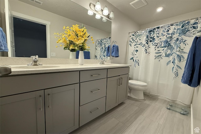 6129 W Coulee Ln, West Jordan, UT 84081 - full bath featuring visible vents, a sink, double vanity, and toilet