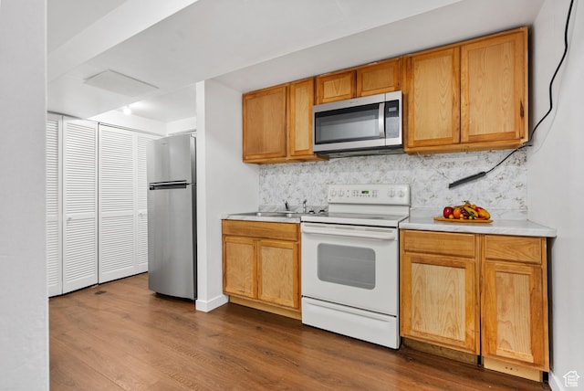 4217 S Hopi Dr, West Valley City, UT 84119 - kitchen with stainless steel appliances, dark wood-type flooring, light countertops, and decorative backsplash