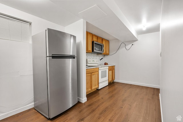 4217 S Hopi Dr, West Valley City, UT 84119 - kitchen featuring appliances with stainless steel finishes, dark wood finished floors, tasteful backsplash, light countertops, and baseboards