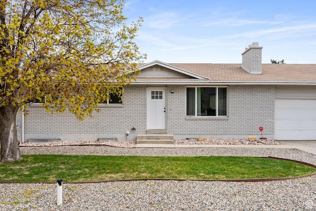 4217 S Hopi Dr, West Valley City, UT 84119 - single story home with brick siding, a garage, entry steps, a chimney, and driveway