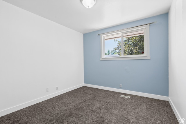 4217 S Hopi Dr, West Valley City, UT 84119 - empty room featuring dark carpet and baseboards
