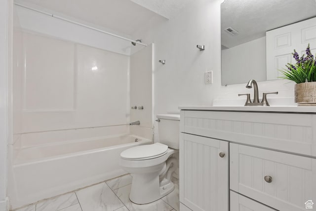 4217 S Hopi Dr, West Valley City, UT 84119 - bathroom featuring vanity, toilet, washtub / shower combination, a textured ceiling, and marble look tiles