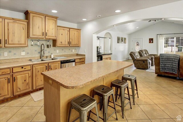5701 S 2700 W, Roy, UT 84067 - kitchen with a sink, a kitchen breakfast bar, stainless steel dishwasher, open floor plan, and arched walkways