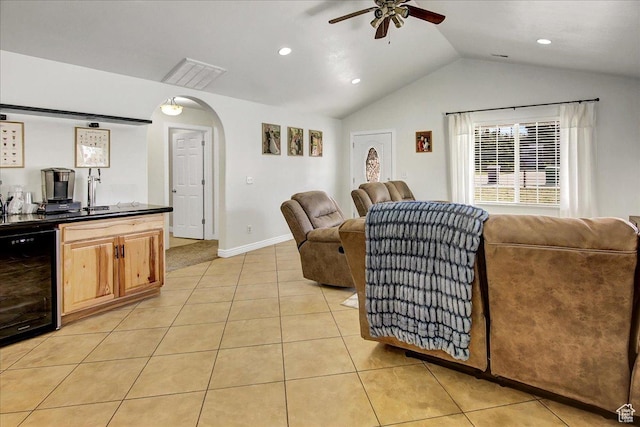 5701 S 2700 W, Roy, UT 84067 - living area with wine cooler, ceiling fan, arched walkways, light tile patterned floors, and lofted ceiling