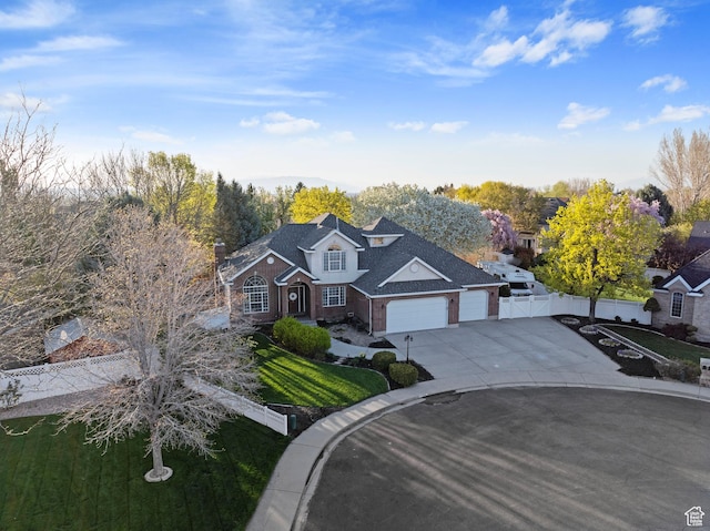 1380 S 980 E, Spanish Fork, UT 84660 - traditional-style home with a gate, driveway, fence, a garage, and brick siding