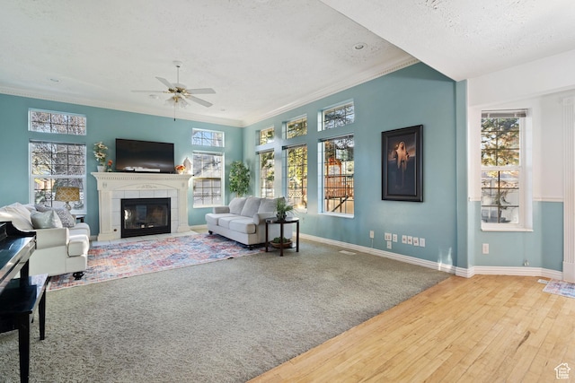 1380 S 980 E, Spanish Fork, UT 84660 - living room with a fireplace, a textured ceiling, a ceiling fan, and baseboards