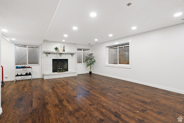 1380 S 980 E, Spanish Fork, UT 84660 - unfurnished living room with recessed lighting, wood finished floors, a brick fireplace, and baseboards