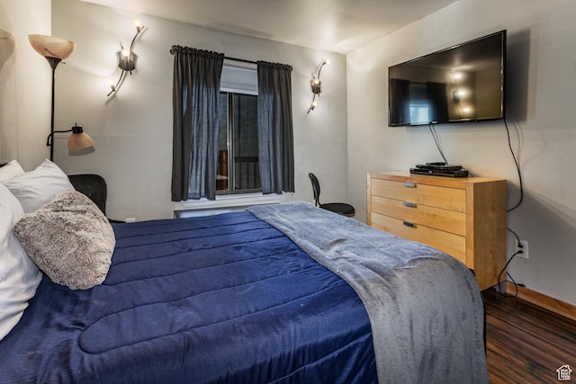 bedroom featuring wood finished floors