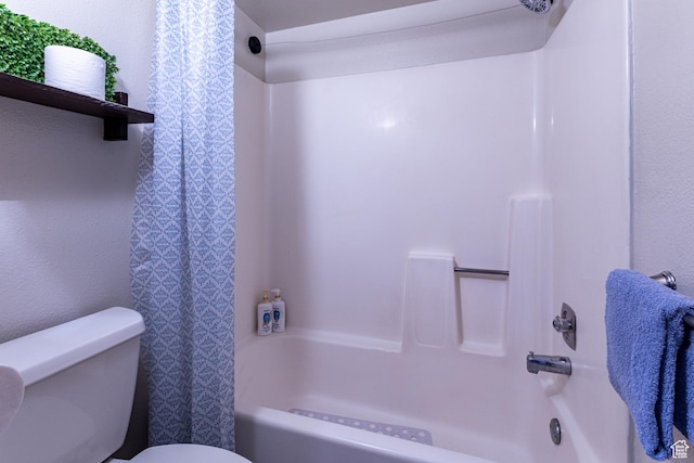 bathroom featuring toilet and shower / tub combination