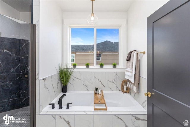 full bath with a bath and a marble finish shower